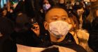 Chinese police search people's phones after anti-lockdown protests erupt across country