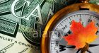 Loonie sinks as Bank of Canada cuts borrowing costs again