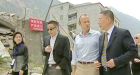 Day pays emotional visit to quake site