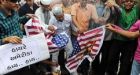 Pastor calls off Koran burning in deal