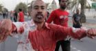 Bahrain's troops shoot at protesters as mourners call for monarchy's ouster