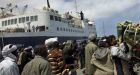 Gadhafi forces bomb port while aid ship docked