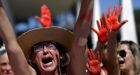 Brazilian police swarm Rio slums for suspects after girl's gang rape