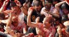 Annual tomato battle leaves Spanish town awash in red pulp